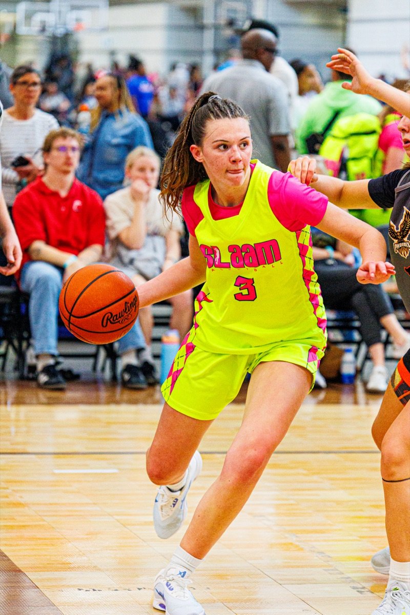 A SLAAM player driving past a defender during a tournament.