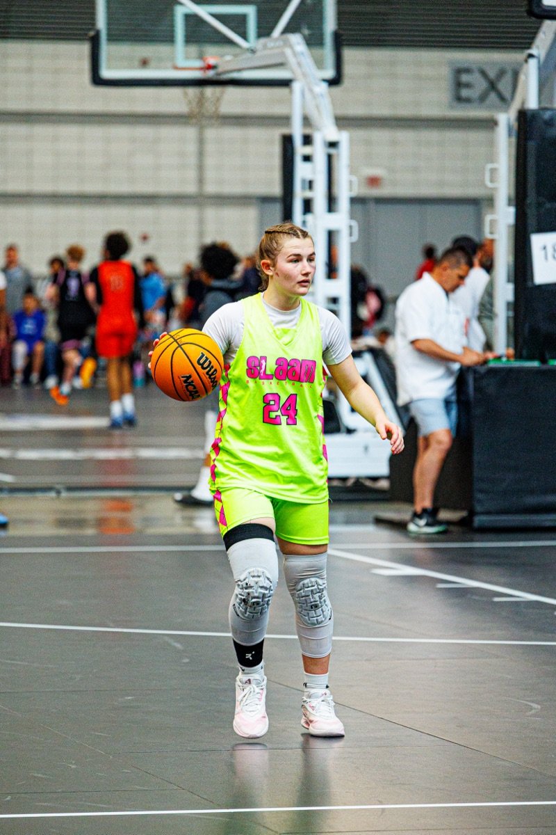 A SLAAM player dribbling up the court.