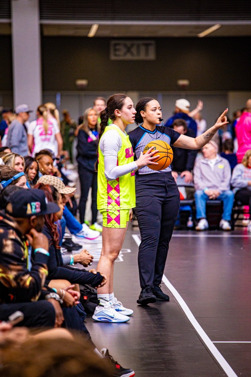 A SLAAM player checking in with a referee.